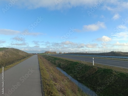 Completed road in Motiekaicio street. New road in Siaulai. Finished road in suburbs. Fields at side. Baigta gatve Motiekaicio gatveje Siauliuose. photo