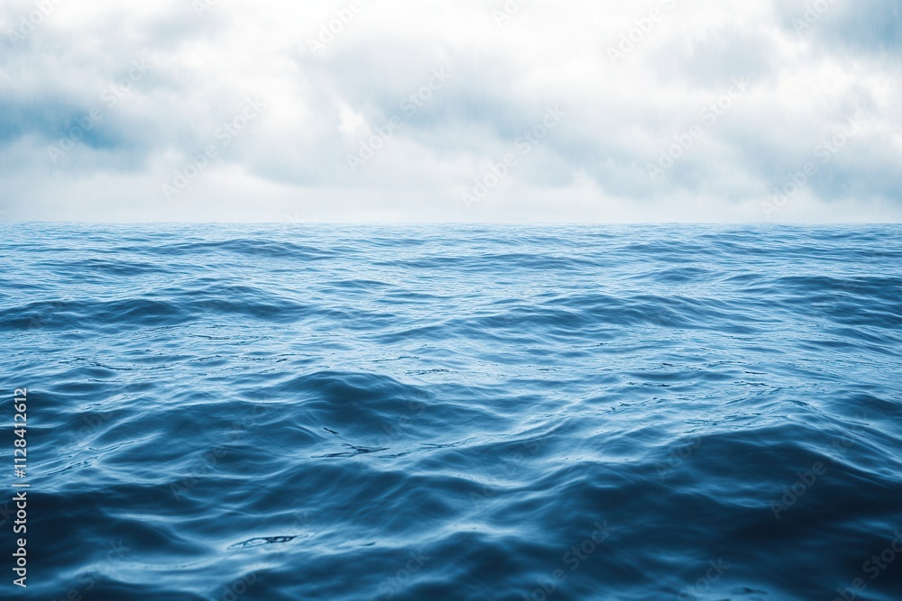 Calm ocean waves under a cloudy sky. Calm ocean waves under a cloudy sky.