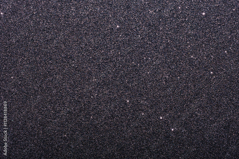 A black and white photo of a black and white background with a lot of glitter A black and white photo of a black and white background with a lot of glitter