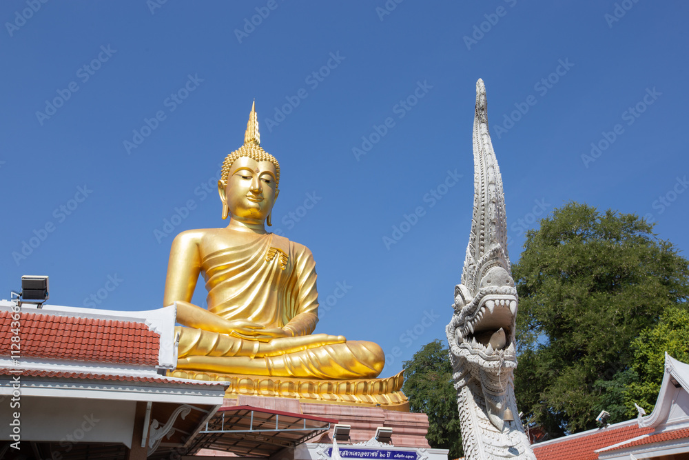 Beautiful big Golden Buddha statue under clear and sunny sky in Khueang Nai District, Ubon Ratchathani, Thailand Beautiful big Golden Buddha statue under clear and sunny sky in Khueang Nai District, Ubon Ratchathani, Thailand