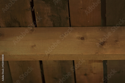 Wooden log and boards lying on it.