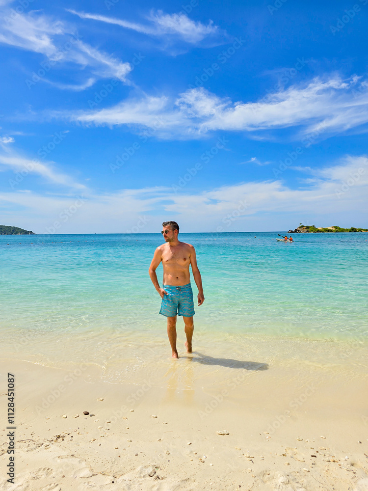 Enjoying a sunny day at Samae San Island in Thailand's crystal-clear waters Enjoying a sunny day at Samae San Island in Thailand's crystal-clear waters