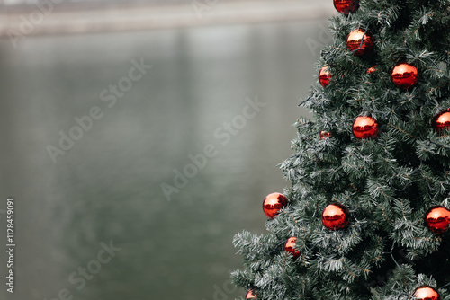 Close up of balls on christmas tree. Bokeh garlands in the background. New Year concept.