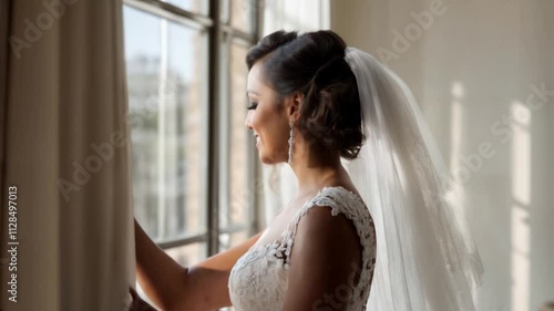 Portrait of a very attractive black woman in a wedding dress in an interior illuminated with natural light