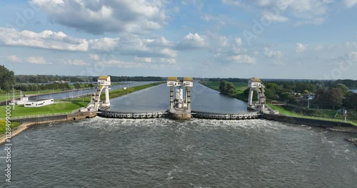 Aerial drone video on The Hagestein weir and lock complex is located in the Lek near the village of Hagestein. Hydroelectric power plant. photo