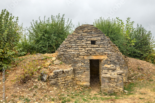 Dry stone wall hut known as Cadole at Plateau de blu, Champagne region, France photo