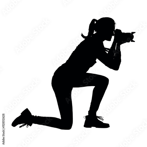 Woman photographer kneeling holding camera aiming at objects side view black silhouette.