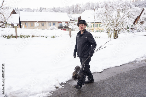 Chimney Sweep Walking Through Snow-Covered Neighborhood In Winter photo