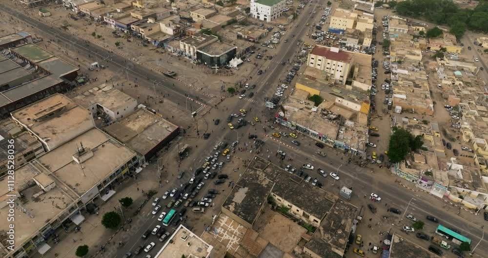 Traffic In The Streets Of Nouakchott City In The Early Morning In Mauritania, Africa. - aerial shot Traffic In The Streets Of Nouakchott City In The Early Morning In Mauritania, Africa. - aerial shot