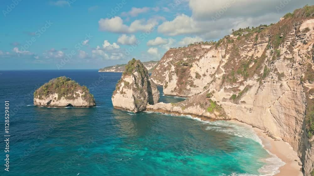 Rock Formations With Crystal-clear Waters At Diamond Beach In Nusa Penida, Bali, Indonesia. static shot Rock Formations With Crystal-clear Waters At Diamond Beach In Nusa Penida, Bali, Indonesia. static shot
