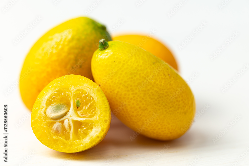 Ripe Chinese mandarins, or Kingen, on white wooden surface. Ripe Chinese mandarins, or Kingen, on white wooden surface.
