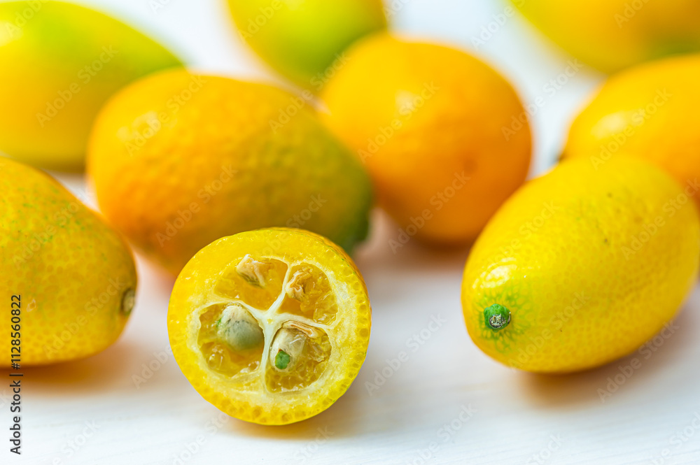 Ripe Chinese mandarins, or Kingen, on white wooden surface. Ripe Chinese mandarins, or Kingen, on white wooden surface.