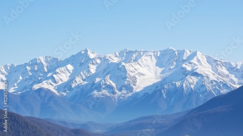 Majestic Snow-Covered Mountain Range Under a Clear Blue Sky