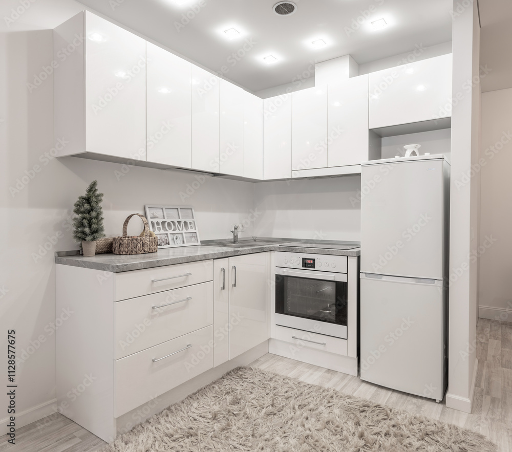 Modern Minimalist Home Kitchen Interior with White Cabinets and Warm Decorative Elements. Scandinavian Style Modern Minimalist Home Kitchen Interior with White Cabinets and Warm Decorative Elements. Scandinavian Style