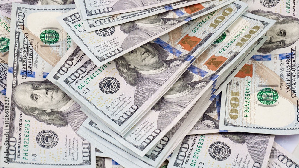 heap of one hundred dollar bills as background, close-up heap of one hundred dollar bills as background, close-up