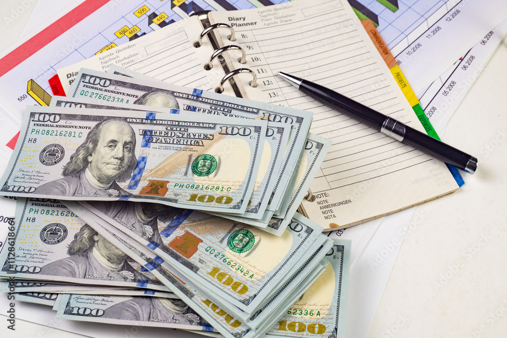 heap of one hundred dollar bills as background, close-up heap of one hundred dollar bills as background, close-up