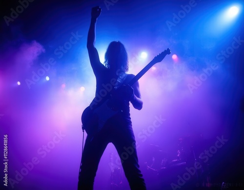 Guitarist Silhouetted on Stage, Purple Lighting 