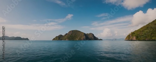 tropical archipelago with lush green islands rising from the crystal-clear turquoise ocean under a bright blue sky.