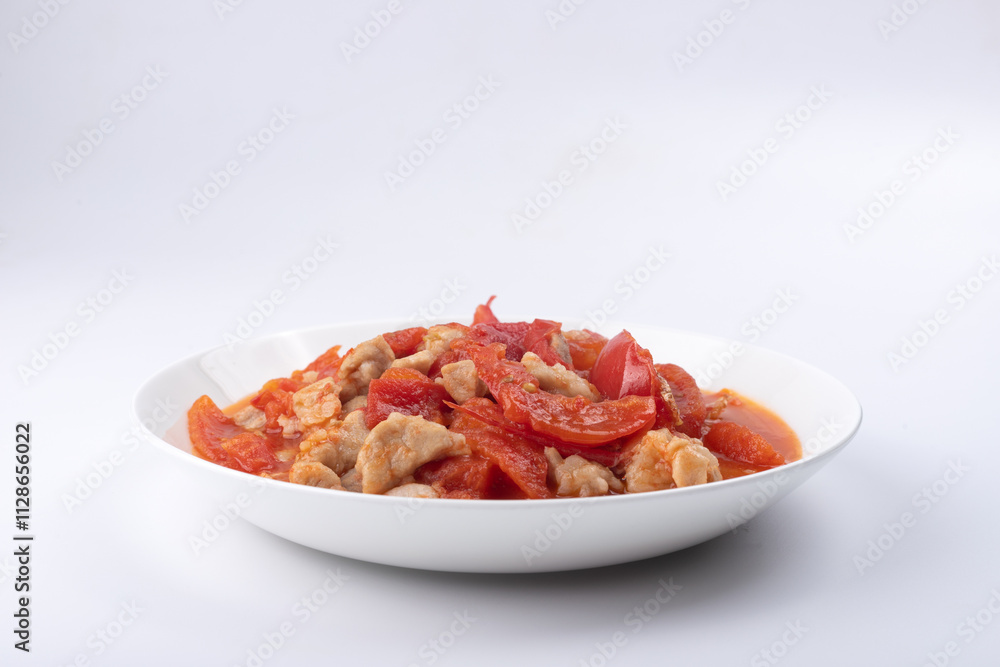 Roast pork with tomatoes on a plate Roast pork with tomatoes on a plate