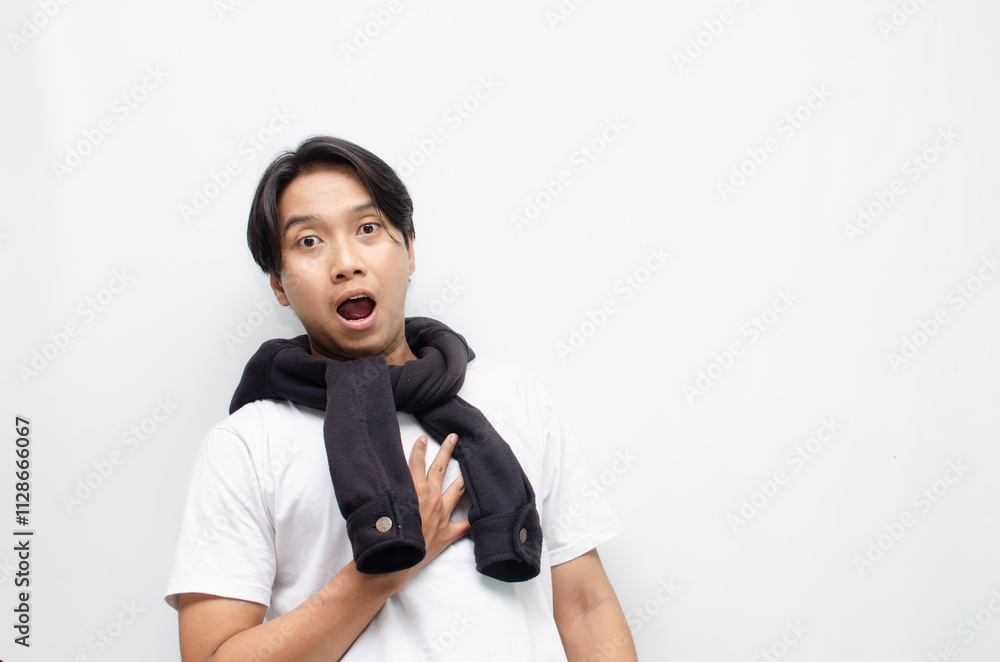 Happy and Surprised Young Asian Man in Casual Outfit Celebrating Victory Happy and Surprised Young Asian Man in Casual Outfit Celebrating Victory