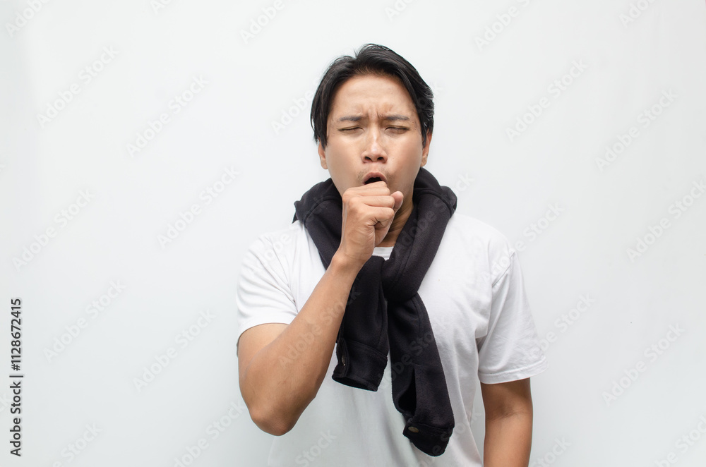 Young Asian Man Coughing and Showing Symptoms of Flu with Fever Young Asian Man Coughing and Showing Symptoms of Flu with Fever