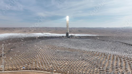 Aerial Drone view from Ashalim power station in Israel
Solar power tower absorbing sunlight from moving mirrors, Drone view, Israel 2024
 photo