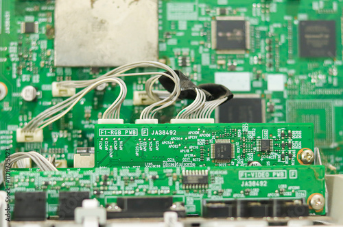  Electronic circuit control panel with wires and connectors distributing functions to different parts. Selective focus.