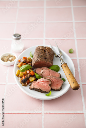 Traditional roast beef with baked vegetables photo