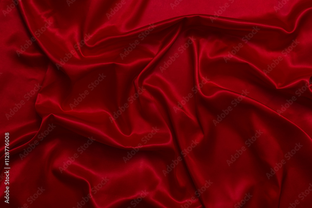 The top view of the red satin surface looks luxurious and beautiful. with sparkling waves Abstract background design copy space Card or banner (blurred or blurry) The top view of the red satin surface looks luxurious and beautiful. with sparkling waves Abstract background design copy space Card or banner (blurred or blurry)
