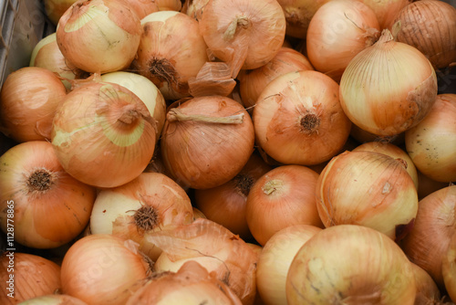 Yellow onions in a market background