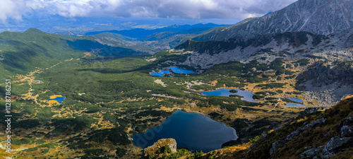 Lakes between mountains. Hiking as a favorite hobby. Active lifestyle. Views of the Tatra Mountains and the High Tatras from hiking trails. Peaks, slopes and valleys between mountains