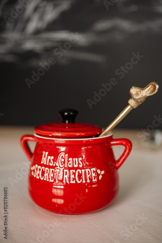 Φωτογραφία Festive red pot with golden spoon celebrating Christmas and New Year traditions