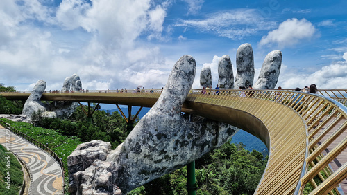 Bridge with hand statue in scenic mountain landscape Vietnam Da Nang Ba Na Hills Asia