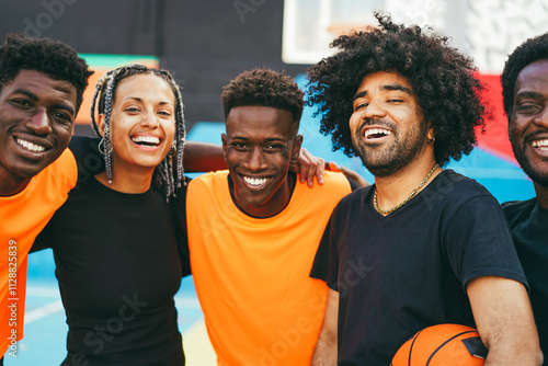 African friends playing basketball outdoor - Urban lifestyle concept - Focus on center latin guy with curly hair