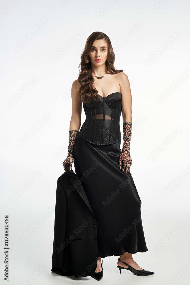 Striking young woman showcases her fashion sense with a glamorous outfit and poised demeanor Striking young woman showcases her fashion sense with a glamorous outfit and poised demeanor
