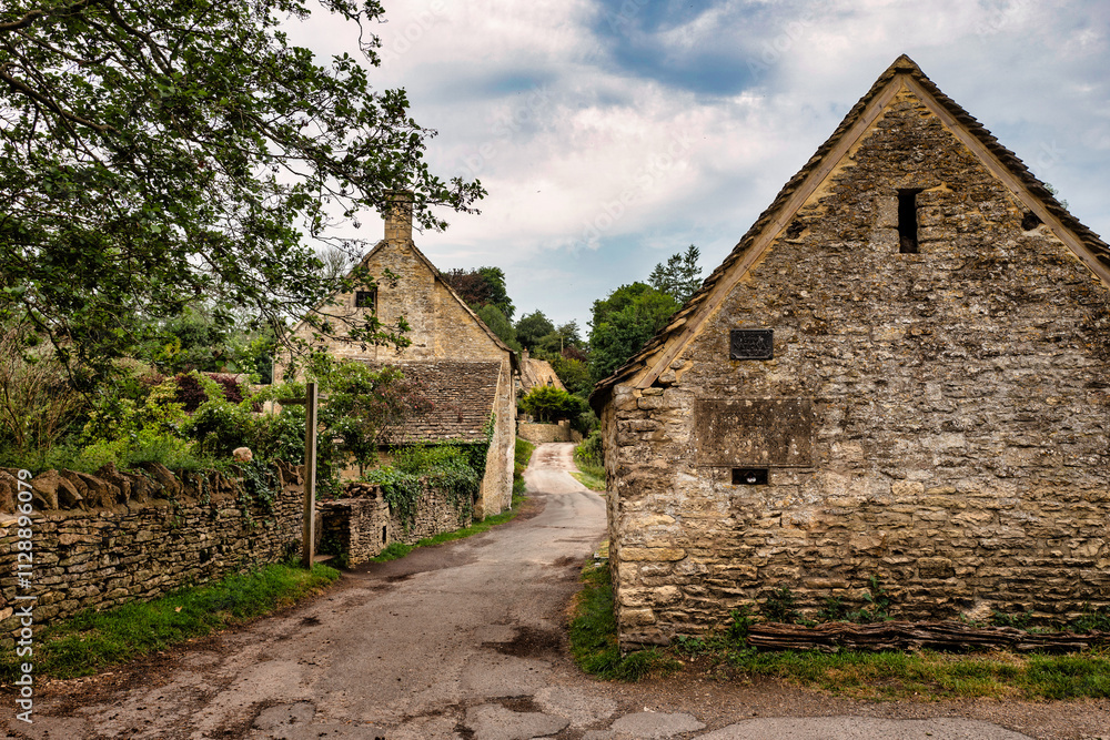Ancient houses in the English village of Cotswolds, Bibury, England Ancient houses in the English village of Cotswolds, Bibury, England
