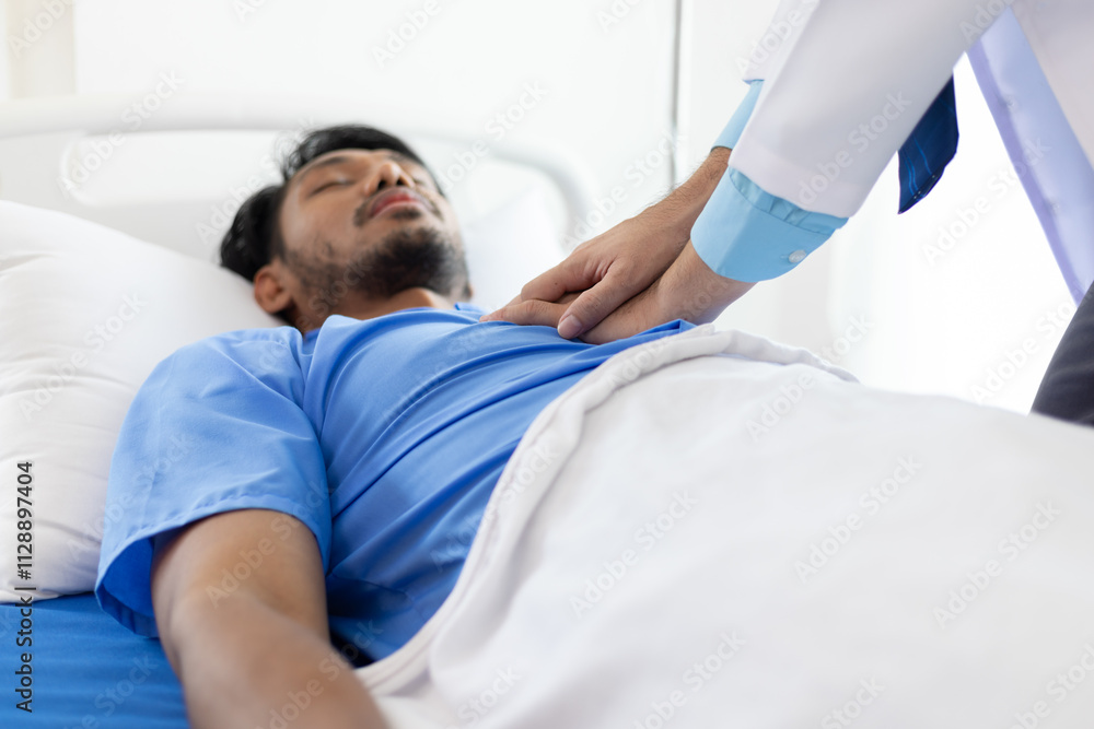 Obraz premium Doctor examining patient lying in hospital bed.