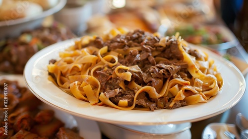 A meal of pasta and boiling beef is called beshbarmak photo