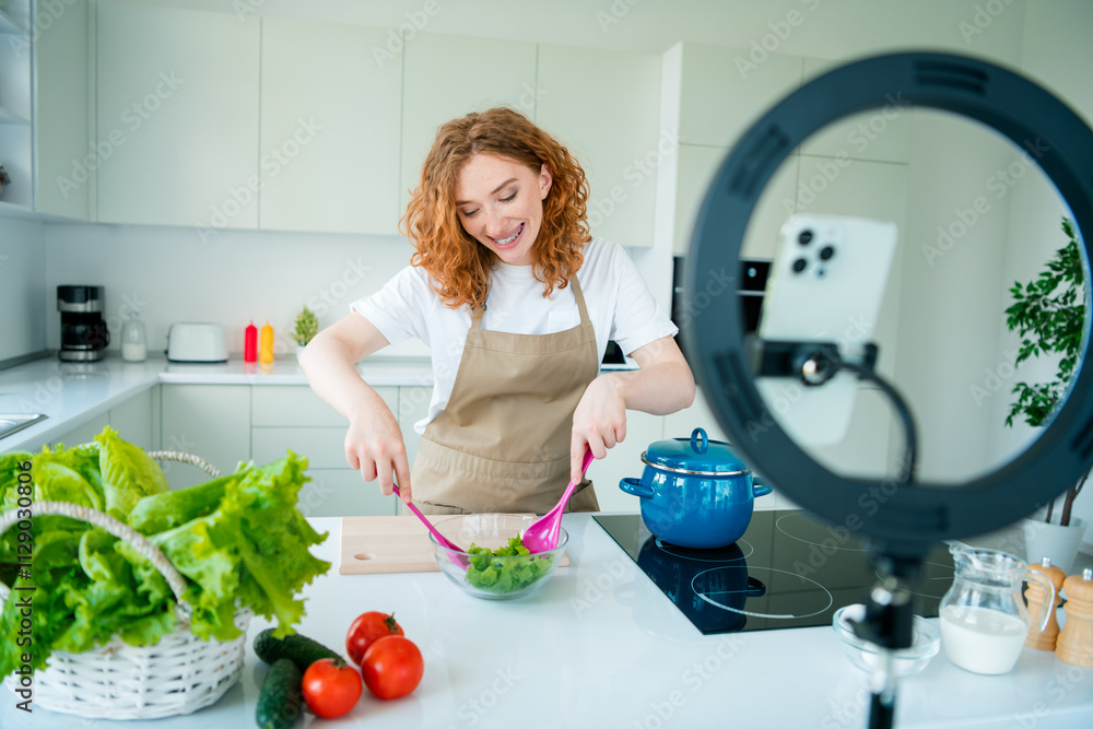 Young female chef creating delicious salad in bright home kitchen with vibrant daylight, capturing the joy of cooking Young female chef creating delicious salad in bright home kitchen with vibrant daylight, capturing the joy of cooking
