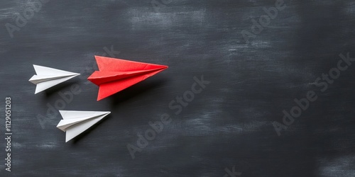 Vibrant paper airplanes in motion against a dark background, symbolizing creativity, innovation, and progress in a fun way. photo