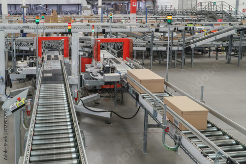 packing line in a logistics warehouse. conveyor belt in a modern production line