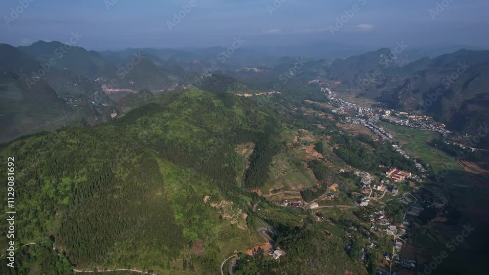 Aerial view of treecovered mountain range in natural landscape Ha Giang Loop Vietnam Asia 4K drone rotation view Aerial view of treecovered mountain range in natural landscape Ha Giang Loop Vietnam Asia 4K drone rotation view