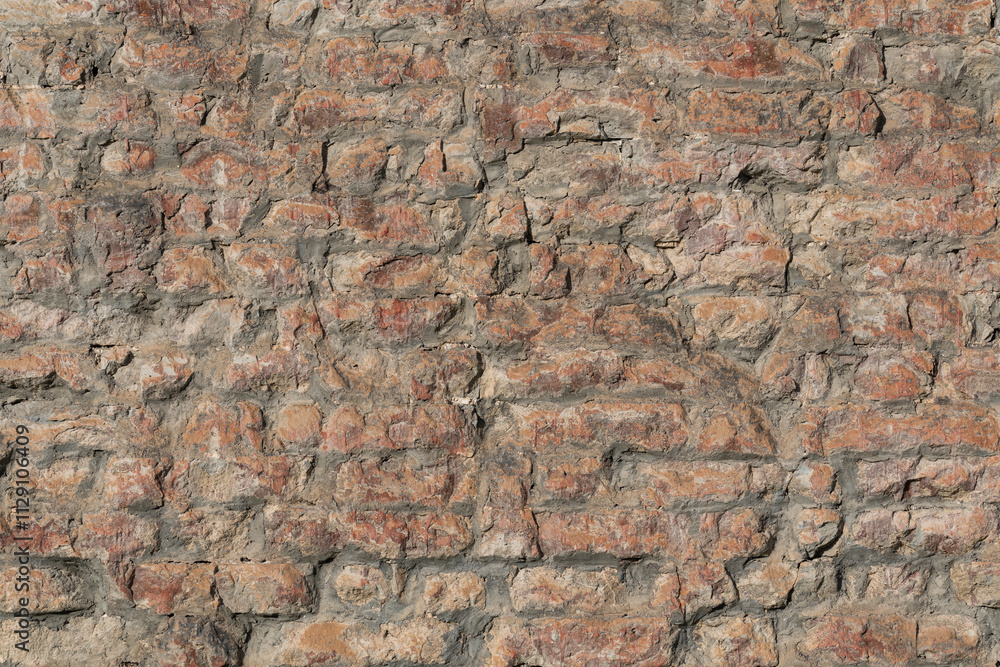 Damaged brick structure surface of the ancient city wall. Building part for texture, close-up. Damaged brick structure surface of the ancient city wall. Building part for texture, close-up.
