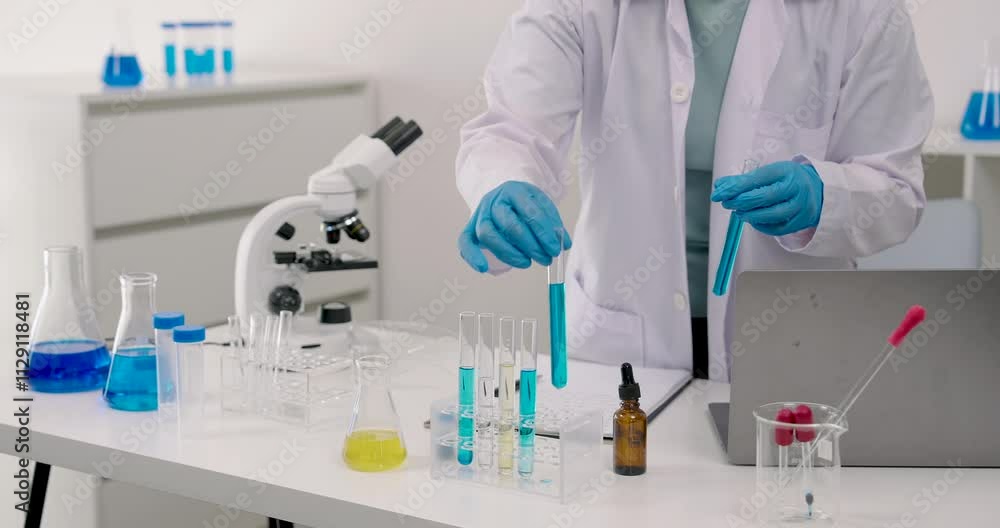 Caucasian schoolgirl wearing lab coat documenting results of scientific experiment with chemical solutions and microscope on table concept research education observation curiosity discovery precision Caucasian schoolgirl wearing lab coat documenting results of scientific experiment with chemical solutions and microscope on table concept research education observation curiosity discovery precision