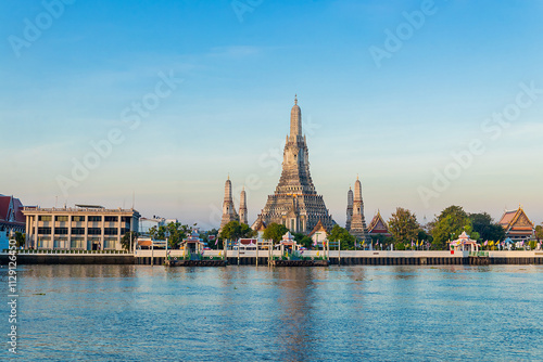 Beautiful of Buddhist temple or Wat Arun Ratchawararam Ratchawaramahawihan with famous tourist landmark sunlight in the morning, Bangkok, Thailand.