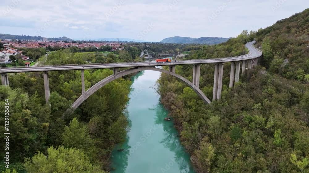 Aerial video around Solkan Bridge - the world's longest stone arch railroad bridge over the Soca River near Nova Gorica in western Slovenia. Aerial video around Solkan Bridge - the world's longest stone arch railroad bridge over the Soca River near Nova Gorica in western Slovenia.
