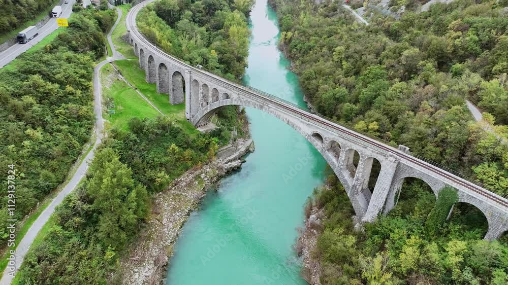 Aerial video around Solkan Bridge - the world's longest stone arch railroad bridge over the Soca River near Nova Gorica in western Slovenia. Aerial video around Solkan Bridge - the world's longest stone arch railroad bridge over the Soca River near Nova Gorica in western Slovenia.