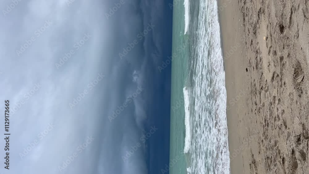 Vertical video of an Atlantic ocean. Ocean waves during thunderstorm. Thunderstorm beach. Beautiful tropical destination concept. Stormy weather at the beach Vertical video of an Atlantic ocean. Ocean waves during thunderstorm. Thunderstorm beach. Beautiful tropical destination concept. Stormy weather at the beach