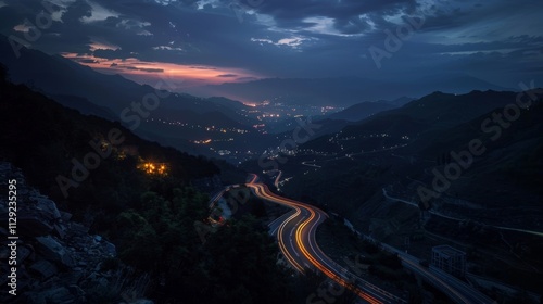 As night falls the mountain roads are alive with the vibrant glow of car light trails leading the way to adventure. photo