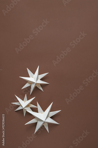 Eco-friendly Christmas banner featuring handmade paper stars earthy brown tones.zero-waste celebrating sustainability,DIY decor,natural holiday charm. Perfect eco-conscious festive design projects photo